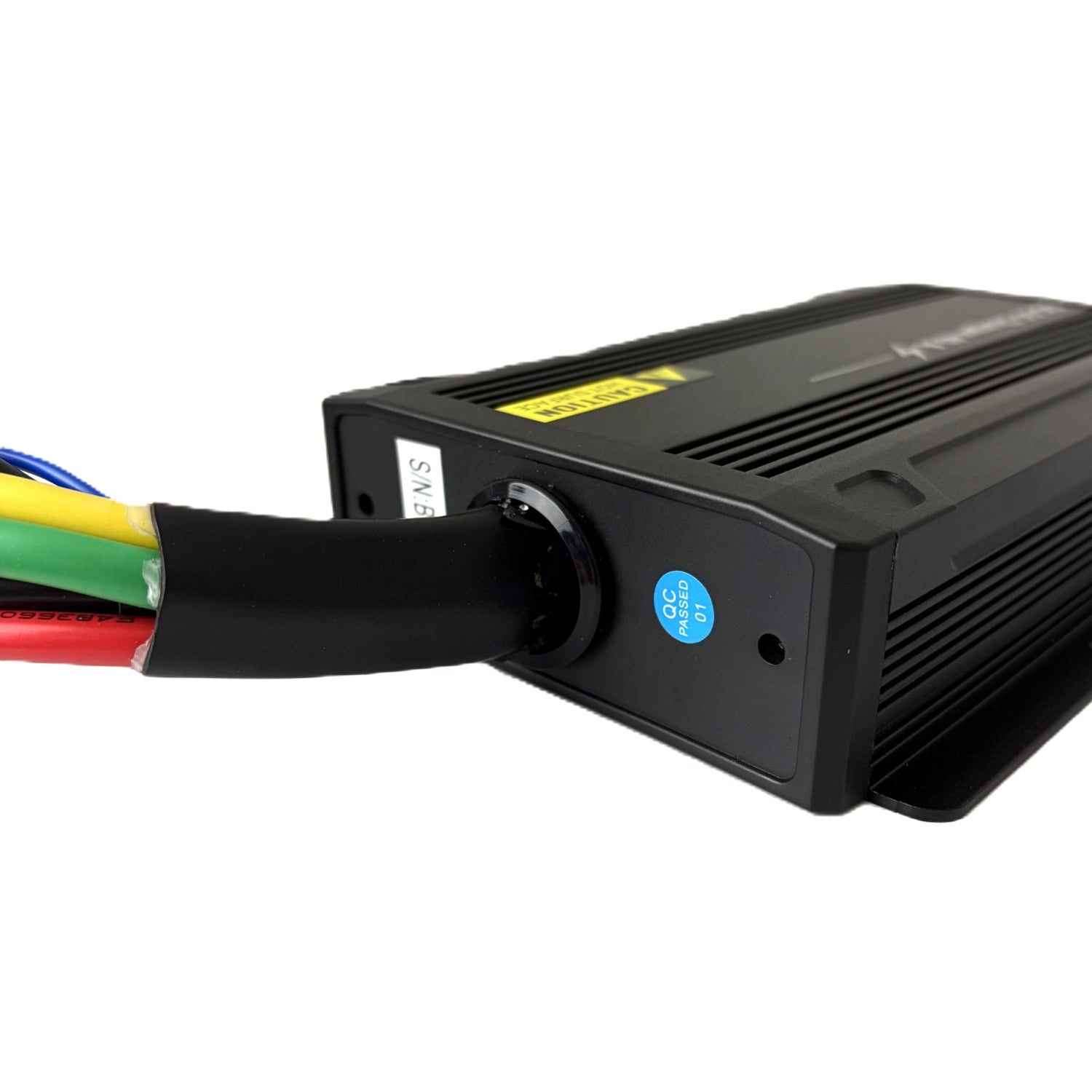 A close-up of the Trolltek™ 12V LiFePO4 Lithium Slimline Battery 4WD Bundle – Charge While Driving (DC) by Trolltek shows its black casing with colored wires (yellow, green, red, blue) connected to one end—perfect for integration with a 12V LiFePO4 lithium battery system—and features a blue “QC Passed” sticker near the wire entry point.