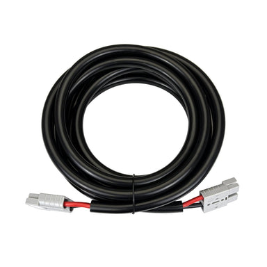 The Trolltek™ Extension Cable is a coiled, heavy-duty 8AWG black cable measuring 5 meters, equipped with gray 50A Anderson plugs on both ends—each connector featuring clearly marked red and black wires—making it ideal for use as an Anderson battery connector cable in dual battery systems.